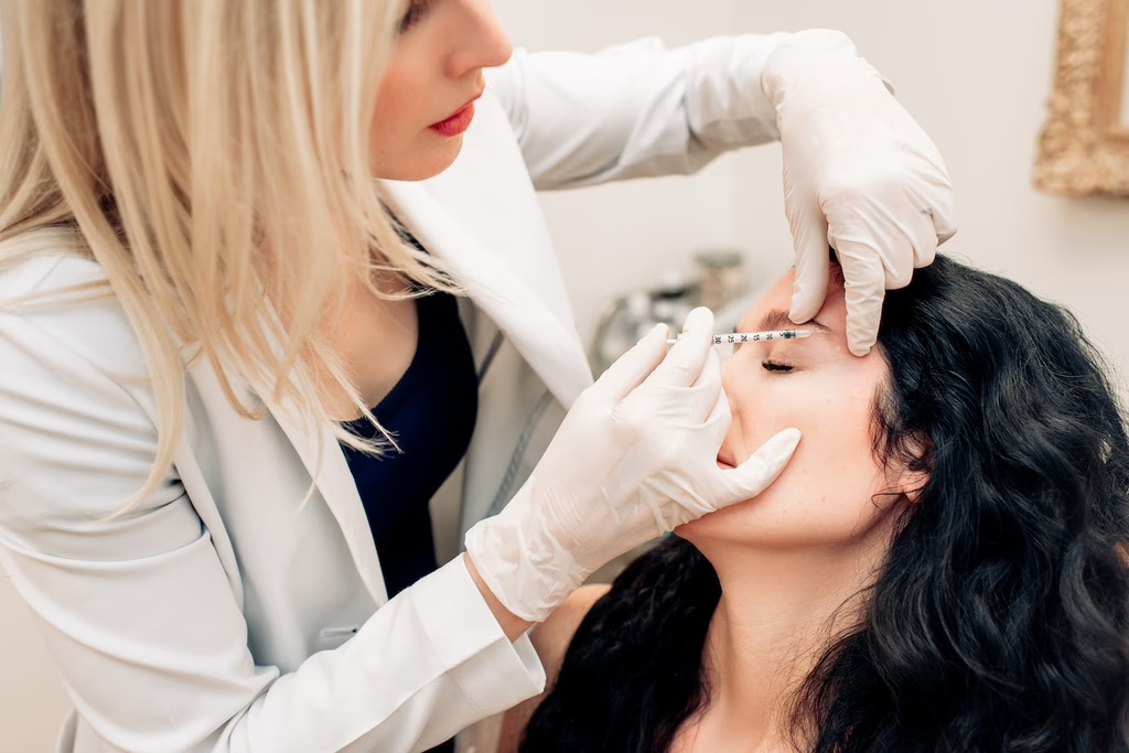 Nurse performing aesthetic treatment